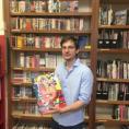 Dash Shaw with his book in the Schulz Library